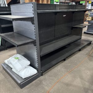 Gondola racking with shelves, pegboard and scanning hooks. Job Lot
