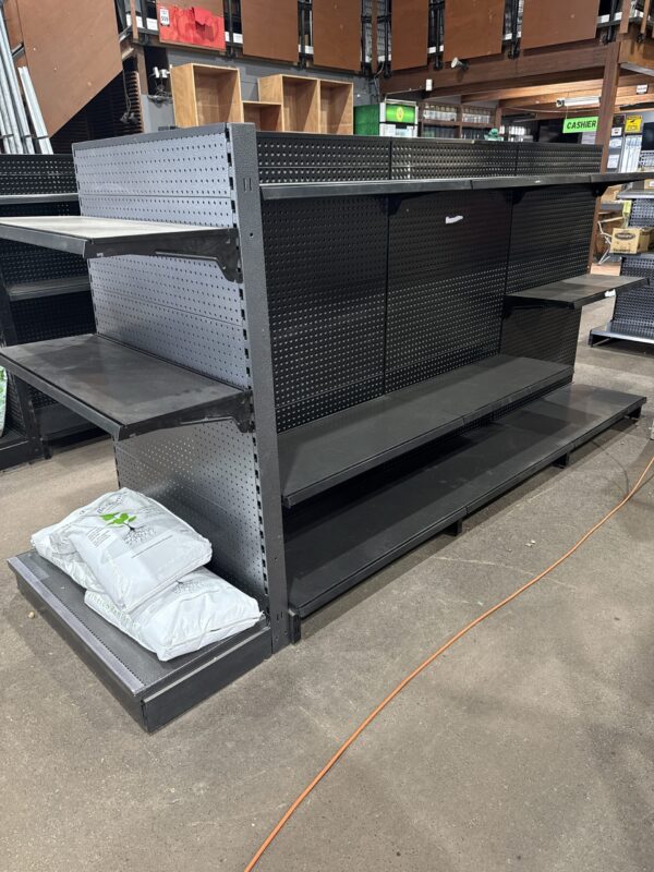 Gondola racking with shelves, pegboard and scanning hooks. Job Lot